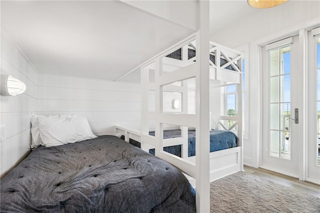 320 S Shore Dr, Port Aransas, TX 78373 - bedroom with multiple windows and wood finished floors