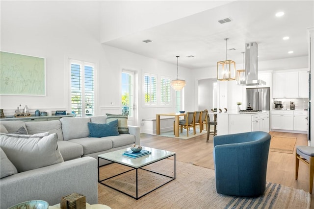 320 S Shore Dr, Port Aransas, TX 78373 - living area with light wood-style floors and recessed lighting