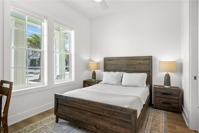 320 S Shore Dr, Port Aransas, TX 78373 - bedroom with wood finished floors and a ceiling fan