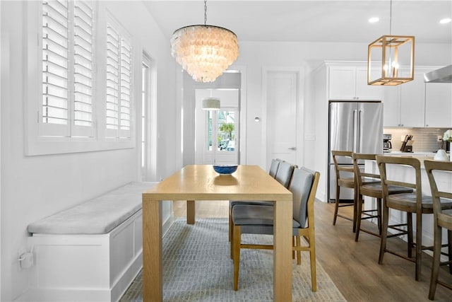 320 S Shore Dr, Port Aransas, TX 78373 - dining area featuring a chandelier, wood finished floors, and recessed lighting