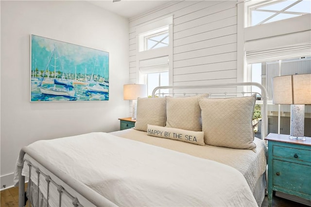 328 Coastline Dr, Port Aransas, TX 78373 - bedroom with dark wood-style floors and baseboards