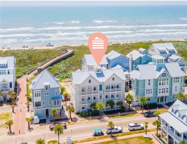 328 Coastline Dr, Port Aransas, TX 78373 - aerial perspective of suburban area with waterfront with a beach