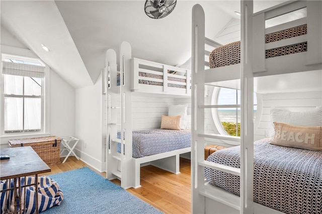 328 Coastline Dr, Port Aransas, TX 78373 - bedroom with vaulted ceiling and wood finished floors