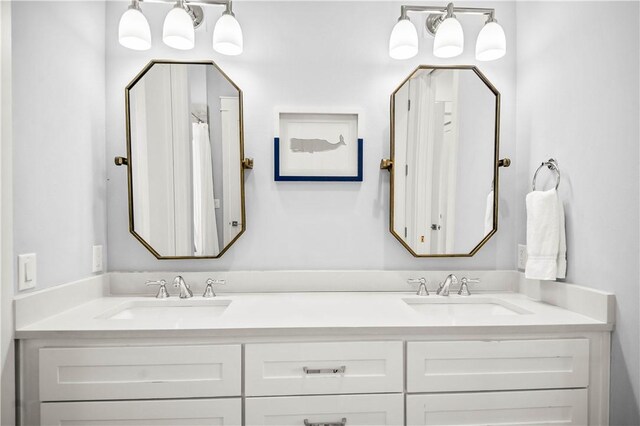 328 Coastline Dr, Port Aransas, TX 78373 - bathroom featuring double vanity