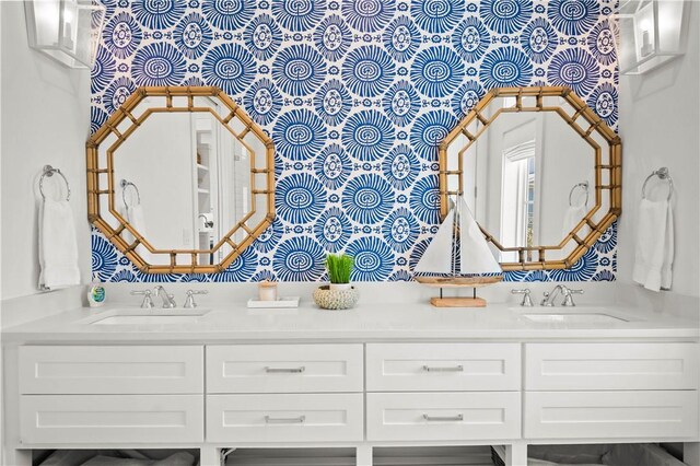 328 Coastline Dr, Port Aransas, TX 78373 - full bathroom with double vanity and wallpapered walls