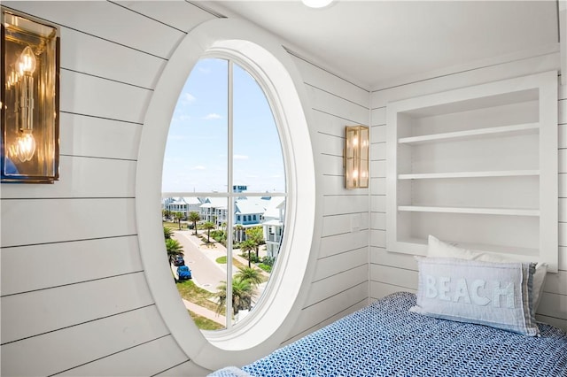 328 Coastline Dr, Port Aransas, TX 78373 - bedroom featuring wooden walls