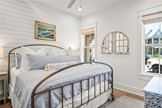 328 Coastline Dr, Port Aransas, TX 78373 - bedroom featuring wood finished floors, wood walls, recessed lighting, and ceiling fan