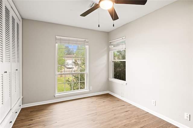 4249 Dody St, Corpus Christi, TX 78411 - unfurnished bedroom with wood finished floors, a closet, and a ceiling fan