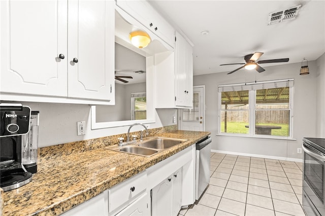 4249 Dody St, Corpus Christi, TX 78411 - kitchen with ceiling fan, appliances with stainless steel finishes, white cabinets, and light tile patterned flooring