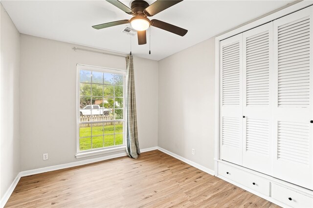 4249 Dody St, Corpus Christi, TX 78411 - unfurnished bedroom with light wood finished floors, a closet, and a ceiling fan