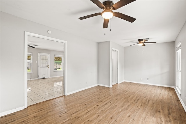 4249 Dody St, Corpus Christi, TX 78411 - empty room featuring light wood-style flooring, ceiling fan, and a smoke detector
