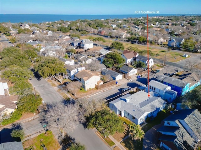 drone / aerial view featuring a water view and a residential view