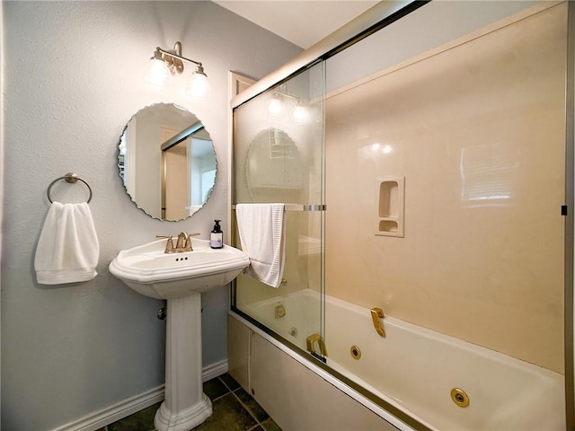 full bathroom with tile patterned flooring, a combined bath / shower with jetted tub, and baseboards