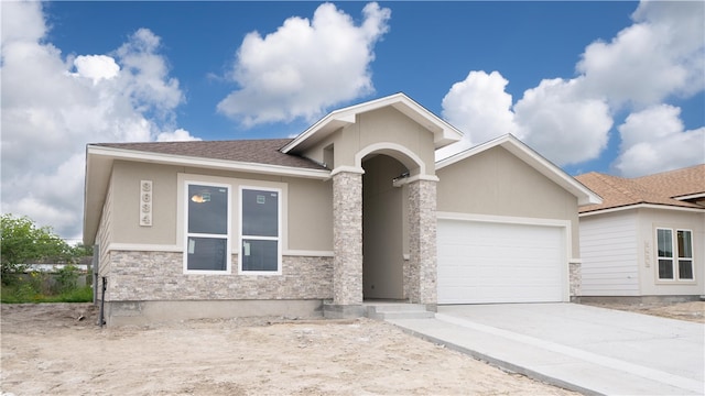 view of front of property with a garage