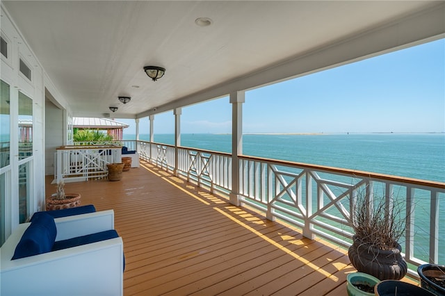 wooden terrace with a water view