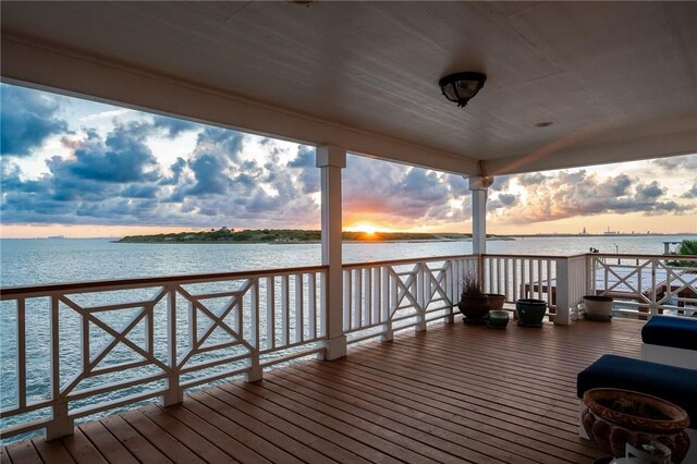 204 Bayshore Dr, Ingleside, TX 78362 - bedroom with wood walls, recessed lighting, and a barn door