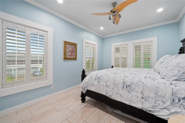 bedroom featuring ceiling fan, multiple windows, and ornamental molding