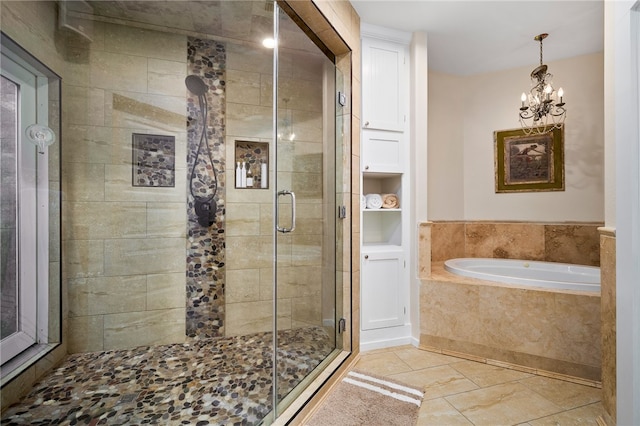 bathroom featuring a chandelier, tile patterned floors, and plus walk in shower