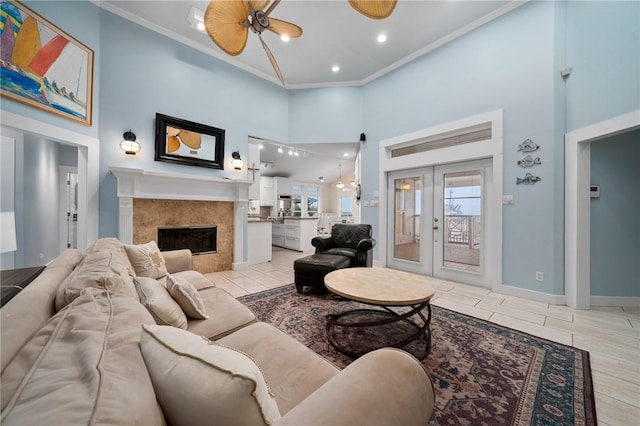 204 Bayshore Dr, Ingleside, TX 78362 - living room with a high ceiling, french doors, a premium fireplace, ornamental molding, and recessed lighting