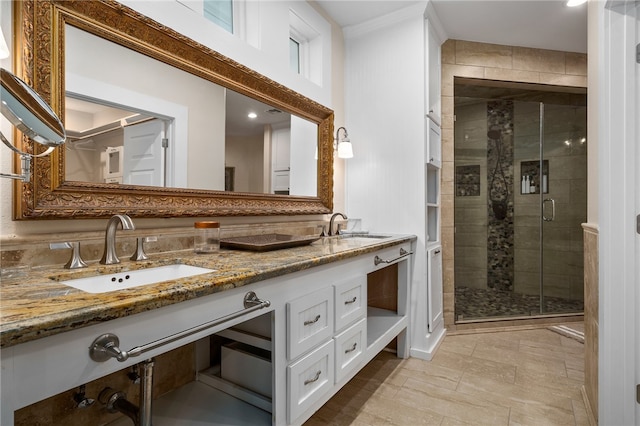 bathroom with walk in shower and vanity