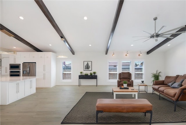 living area featuring recessed lighting, beam ceiling, light wood-style floors, and a ceiling fan