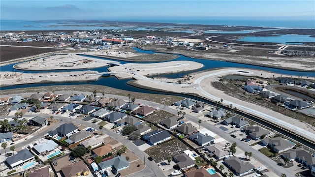 drone / aerial view with a residential view and a water view