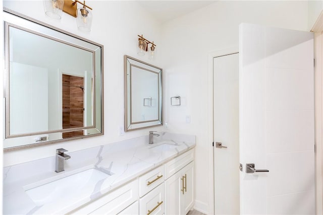 bathroom with double vanity and a sink