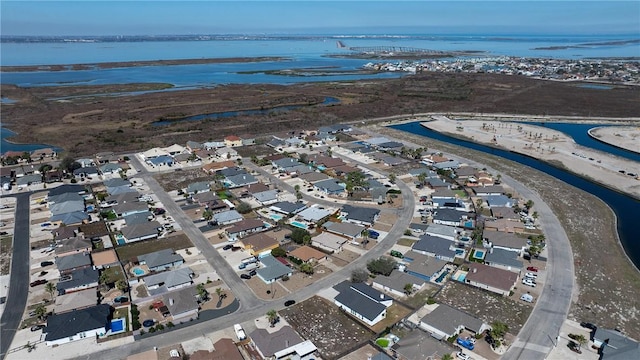 birds eye view of property with a residential view and a water view