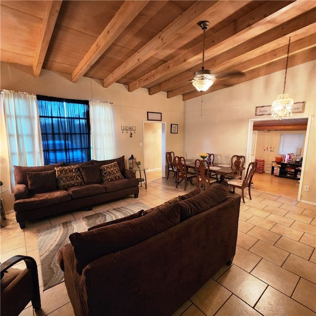 living room featuring ceiling fan with notable chandelier, beam ceiling, light tile patterned floors, and wood ceiling