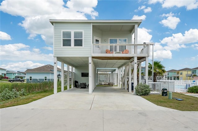 111 Great Chagos, Rockport, TX 78382 - beach home with a carport, stairway, concrete driveway, and a residential view
