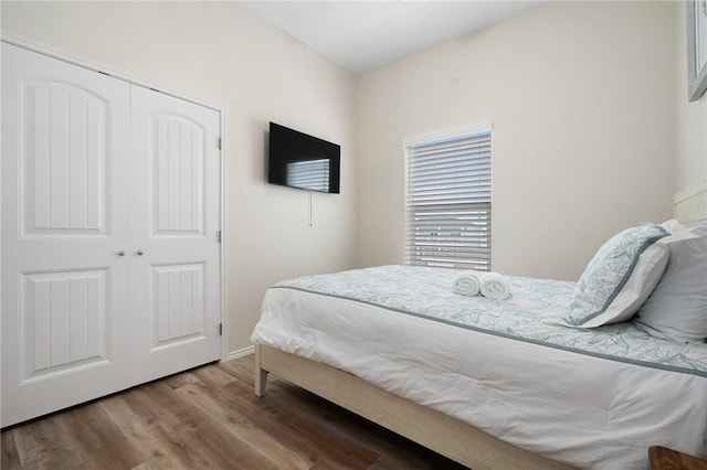 111 Great Chagos, Rockport, TX 78382 - bedroom featuring wood finished floors, a closet, and baseboards