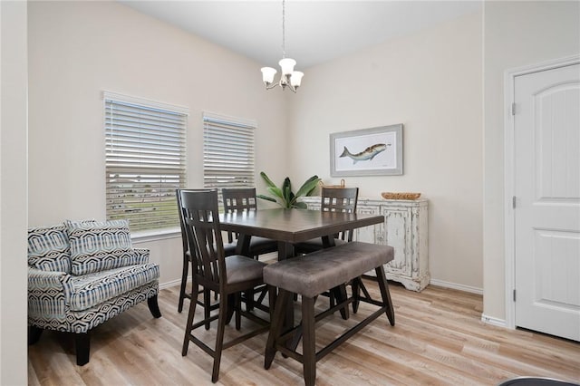 111 Great Chagos, Rockport, TX 78382 - dining space with a chandelier, light wood-style floors, and baseboards