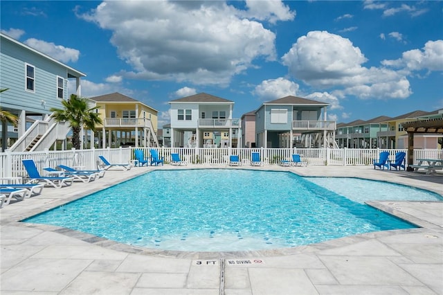 111 Great Chagos, Rockport, TX 78382 - community pool featuring a patio area and a residential view