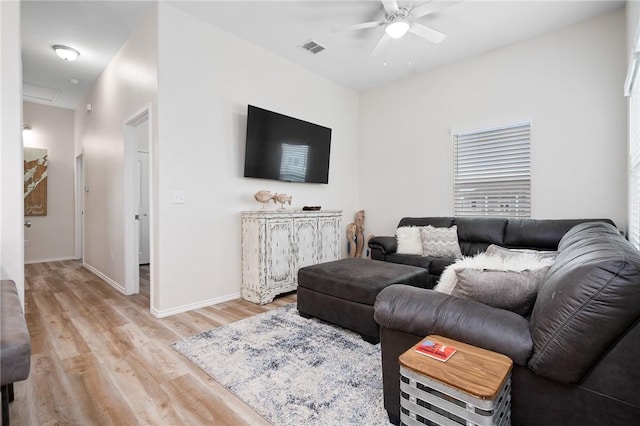 111 Great Chagos, Rockport, TX 78382 - living room featuring a ceiling fan, light wood-style flooring, and baseboards