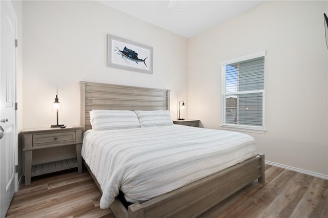 111 Great Chagos, Rockport, TX 78382 - bedroom featuring wood finished floors and baseboards