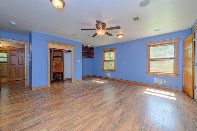 unfurnished bedroom with hardwood / wood-style flooring and ceiling fan