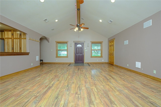 unfurnished living room featuring light wood-type flooring, ceiling fan, and high vaulted ceiling