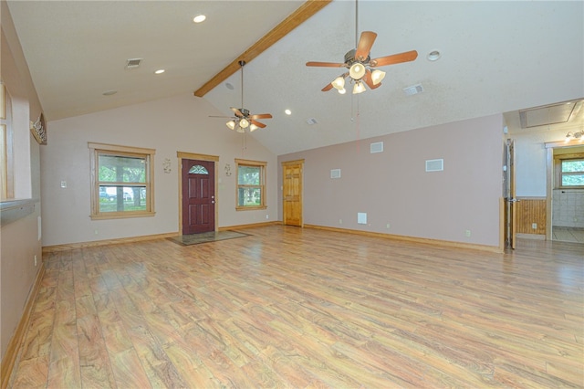 unfurnished living room with ceiling fan, beam ceiling, light hardwood / wood-style flooring, and high vaulted ceiling