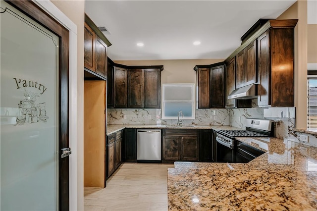 1530 Bay Moon Ct, Corpus Christi, TX 78417 - kitchen with appliances with stainless steel finishes, a sink, under cabinet range hood, light stone counters, and recessed lighting