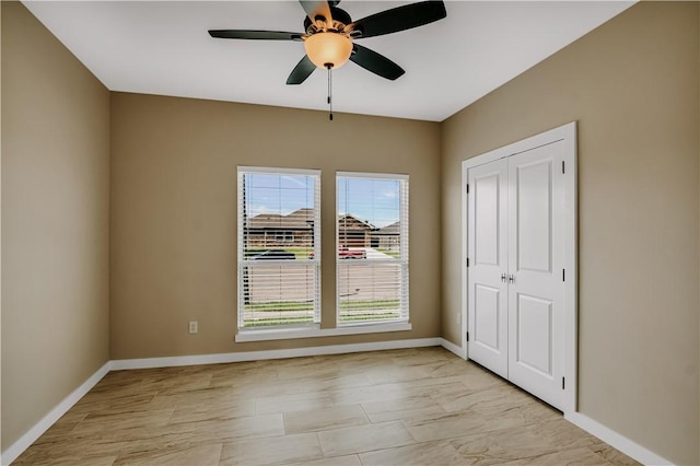 1530 Bay Moon Ct, Corpus Christi, TX 78417 - unfurnished bedroom featuring baseboards, a closet, and ceiling fan
