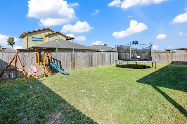 view of yard featuring a playground and a trampoline