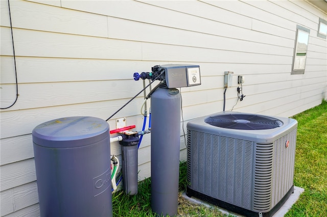 exterior details with central air condition unit and wooden walls