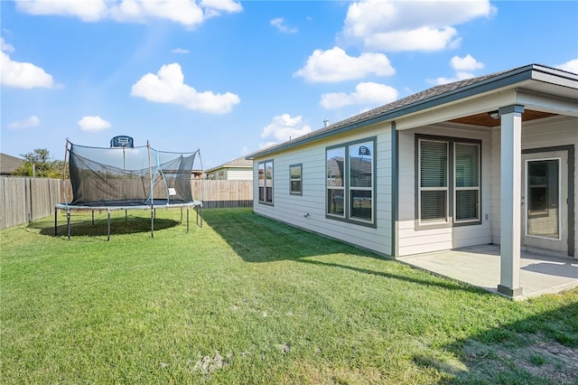 view of yard featuring a patio area and a trampoline