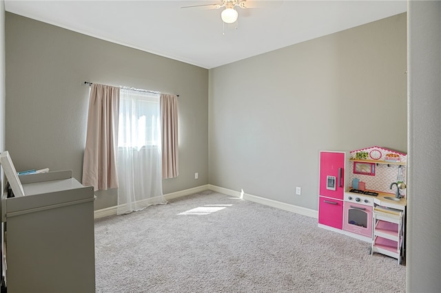 game room with carpet flooring and ceiling fan