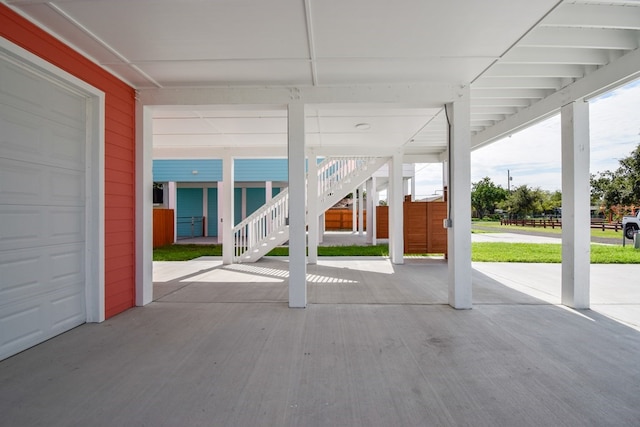 view of patio / terrace with a garage and a carport