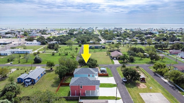aerial perspective of suburban area featuring a nearby body of water
