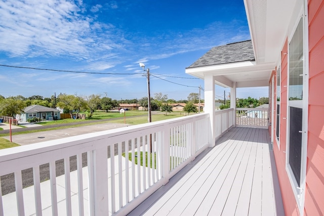 wooden terrace featuring a residential view
