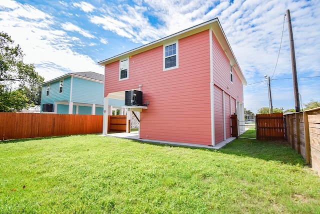 rear view of property with a lawn