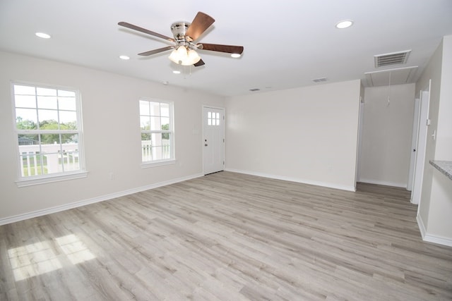 unfurnished living room with ceiling fan and light hardwood / wood-style floors