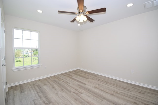 empty room featuring light hardwood / wood-style floors and ceiling fan